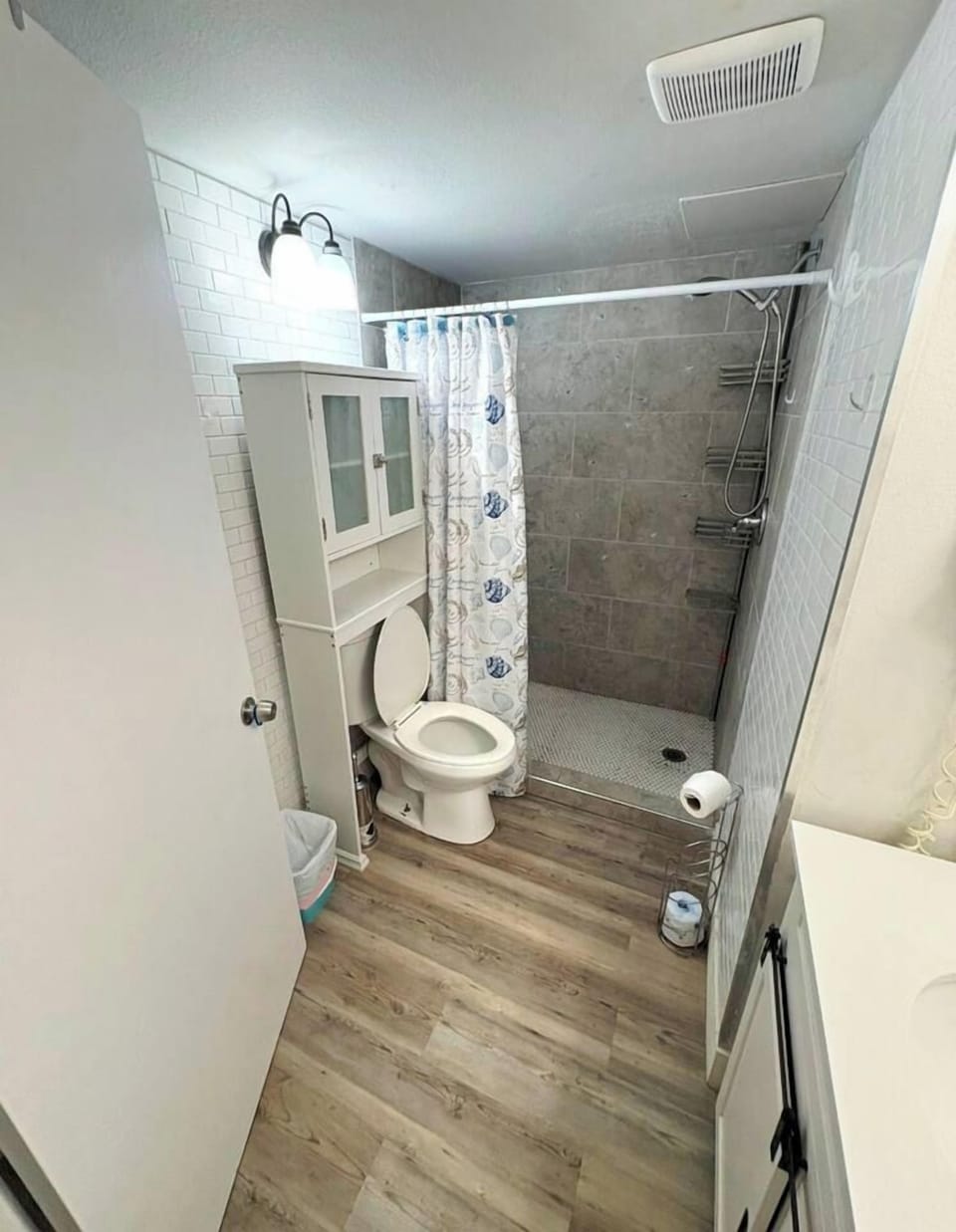Bright modern bathroom with walk-in tiled shower and stylish finishes