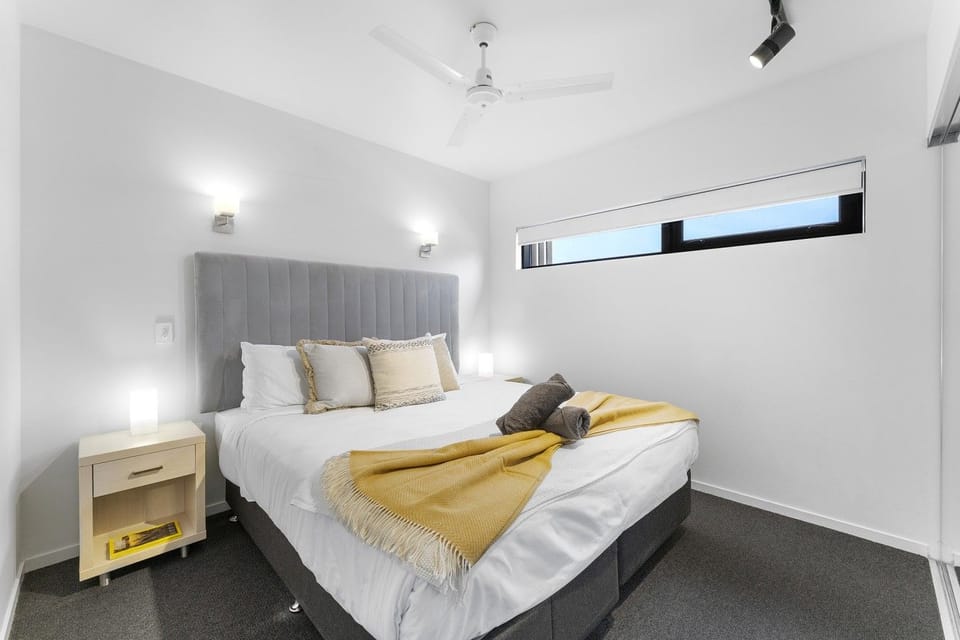 Spacious master bedroom featuring a plush King bed and minimalist design.