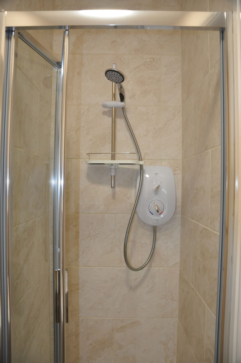 Shower, hair dryer, towels, shampoo
