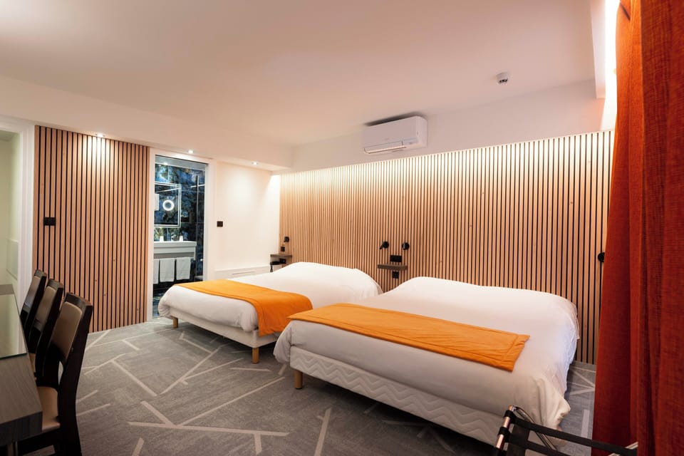 Quadruple Room | Minibar, in-room safe, individually decorated, desk