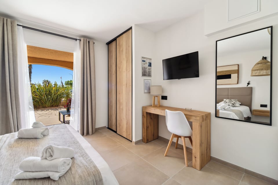 Standard Triple Room, Terrace (Garden View) | Free minibar items, in-room safe, desk, soundproofing