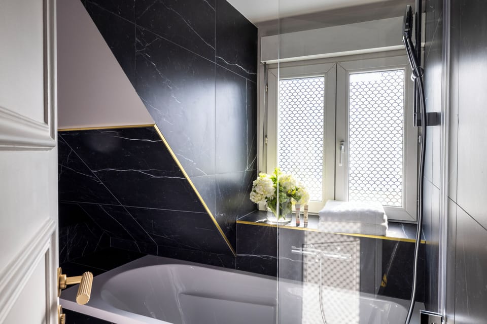 Suite | Bathroom | Hair dryer, bathrobes, slippers, towels