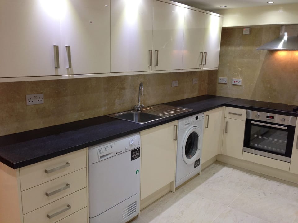 Fridge, microwave, coffee/tea maker, cookware/dishes/utensils