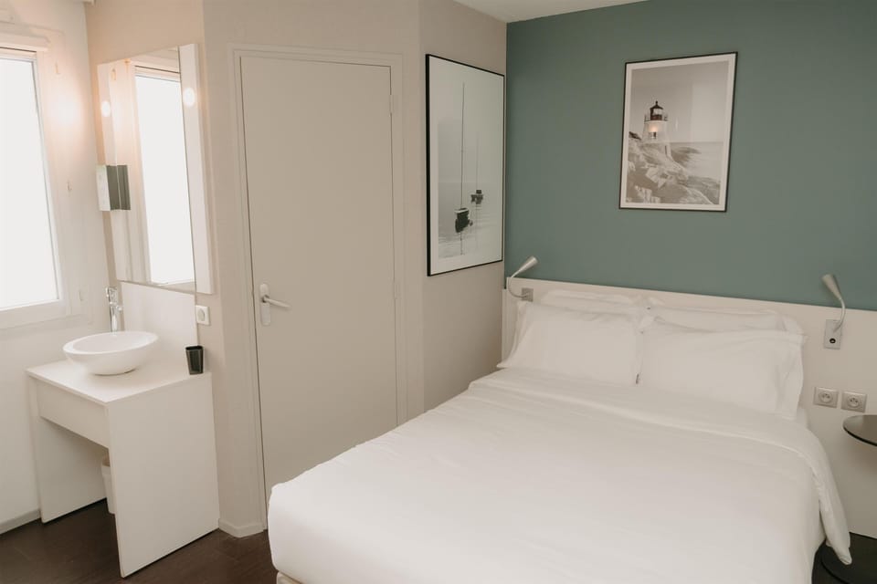 Premium bedding, desk, laptop workspace, blackout drapes