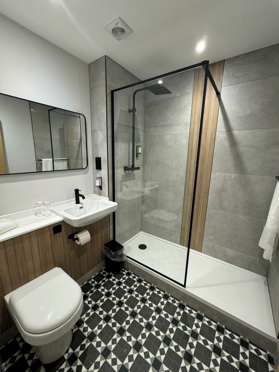 Shower, rainfall showerhead, towels, soap