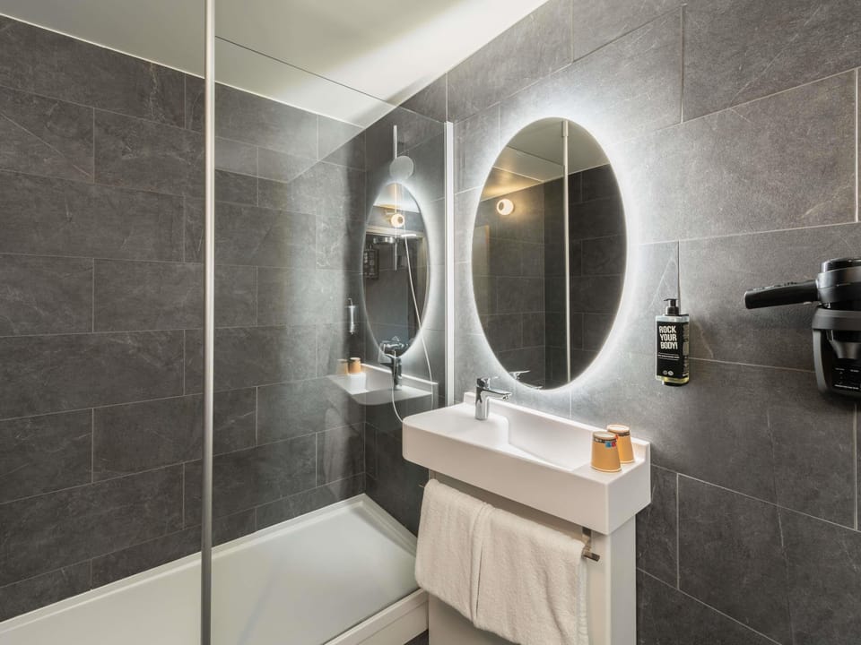 Shower, eco-friendly toiletries, hair dryer, towels
