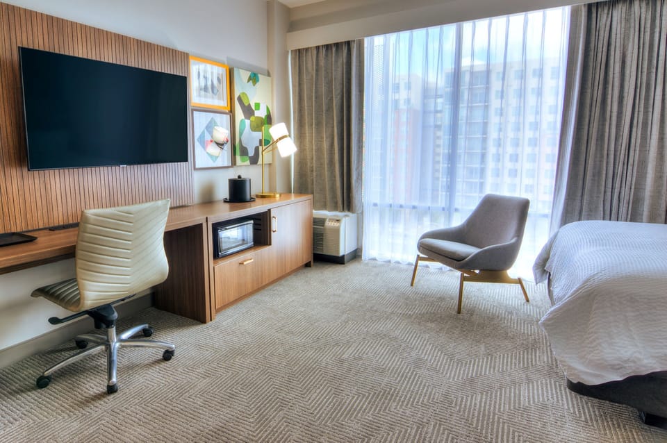 Standard Room | Desk, laptop workspace, blackout drapes, iron/ironing board