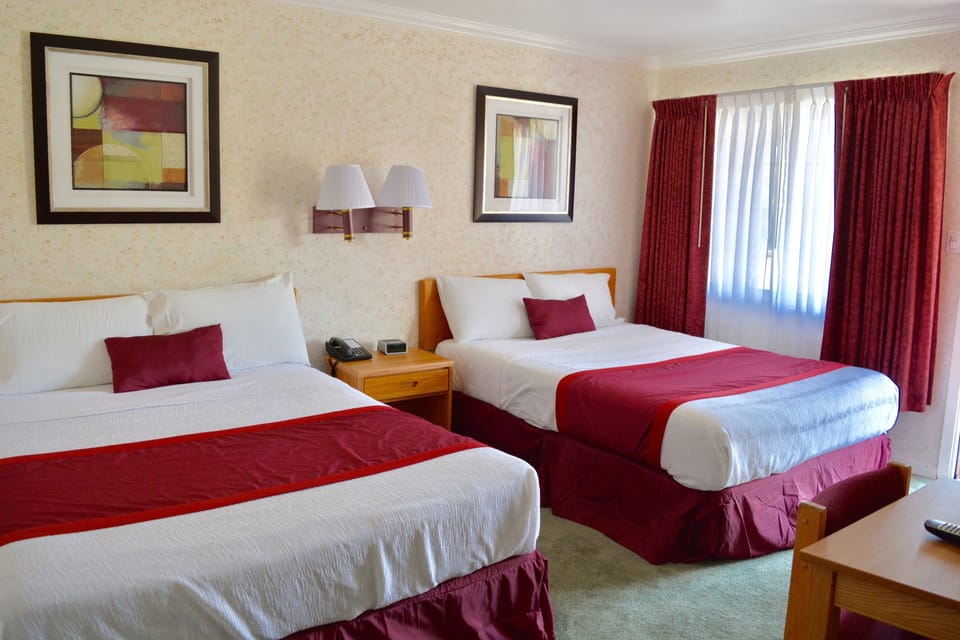Standard Room, 2 Queen Beds | Iron/ironing board, free WiFi, bed sheets