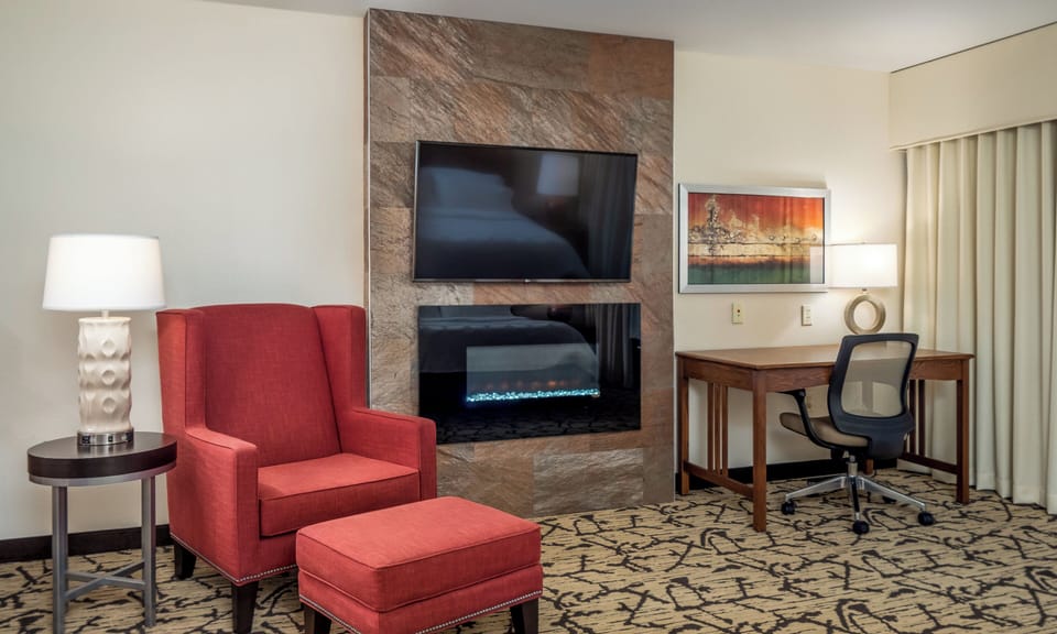 Suite, 1 Bedroom | Desk, laptop workspace, blackout drapes, iron/ironing board