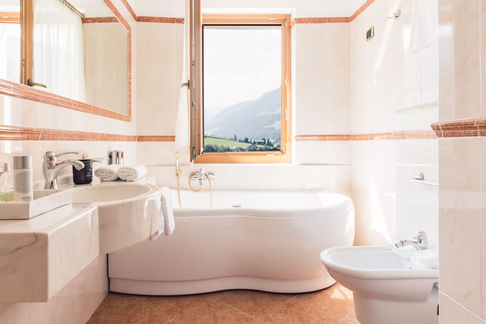 Suite (Sovereign) | Bathroom | Designer toiletries, hair dryer, bathrobes, slippers