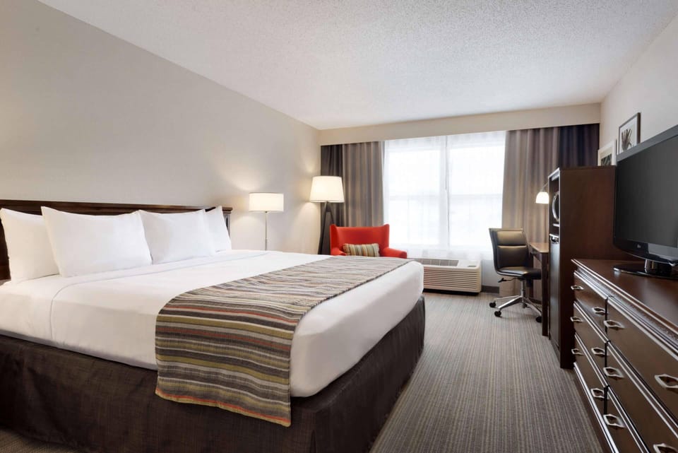 Hypo-allergenic bedding, pillowtop beds, desk, laptop workspace