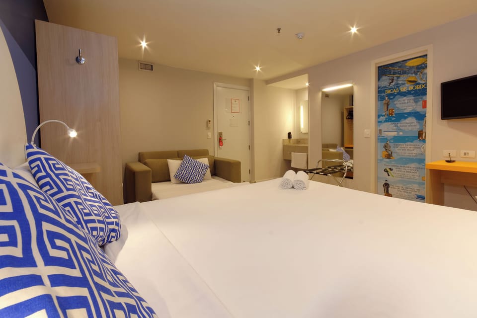 Family Room | Minibar, in-room safe, individually decorated, desk