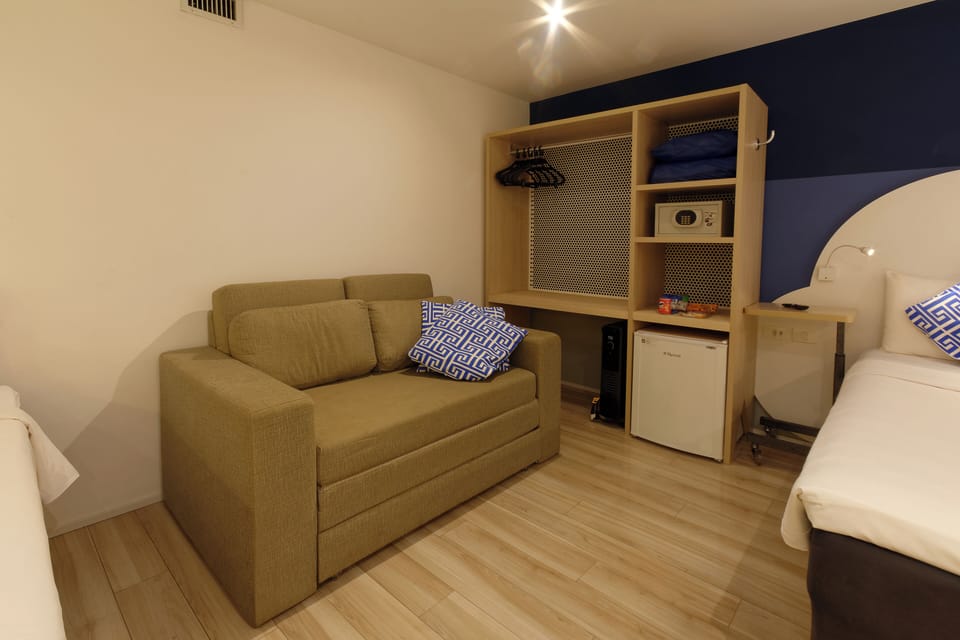 Family Room | Minibar, in-room safe, individually decorated, desk