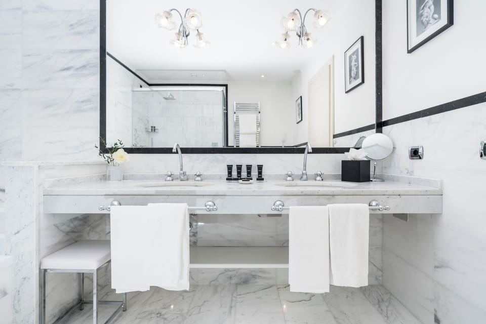 Gran Deluxe | Bathroom | Rainfall showerhead, designer toiletries, hair dryer, bathrobes