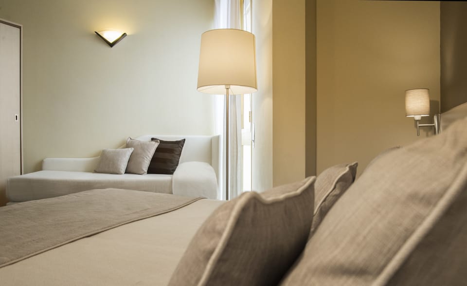 Triple Room | Minibar, in-room safe, desk, iron/ironing board