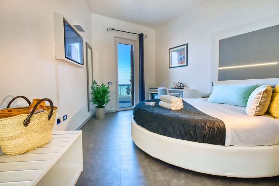 Deluxe Double or Twin Room, Sea View | Free minibar, in-room safe, individually decorated