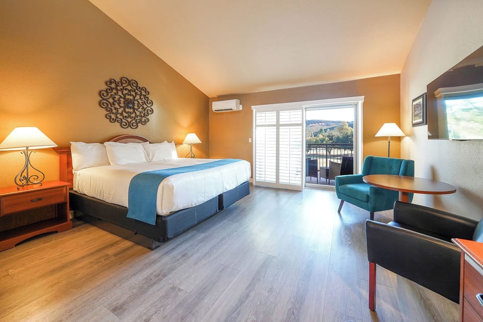 Executive Room, 1 King Bed, Patio, Golf View | Pillowtop beds, desk, laptop workspace, iron/ironing board