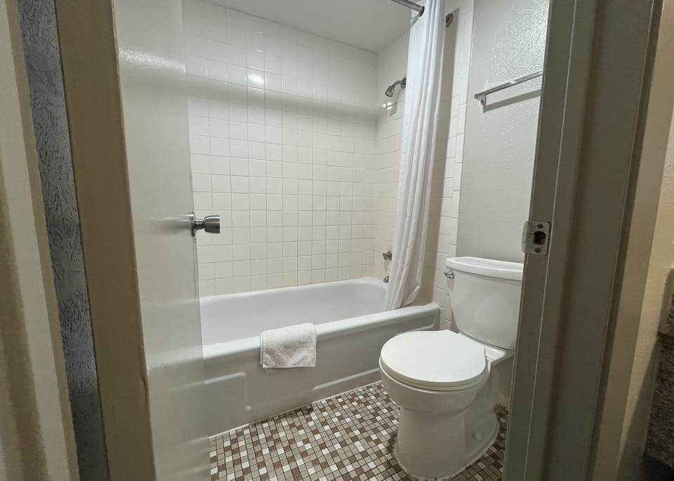 Deluxe Room, 2 Double Beds, Non Smoking | Bathroom | Bathtub, hair dryer, towels, soap