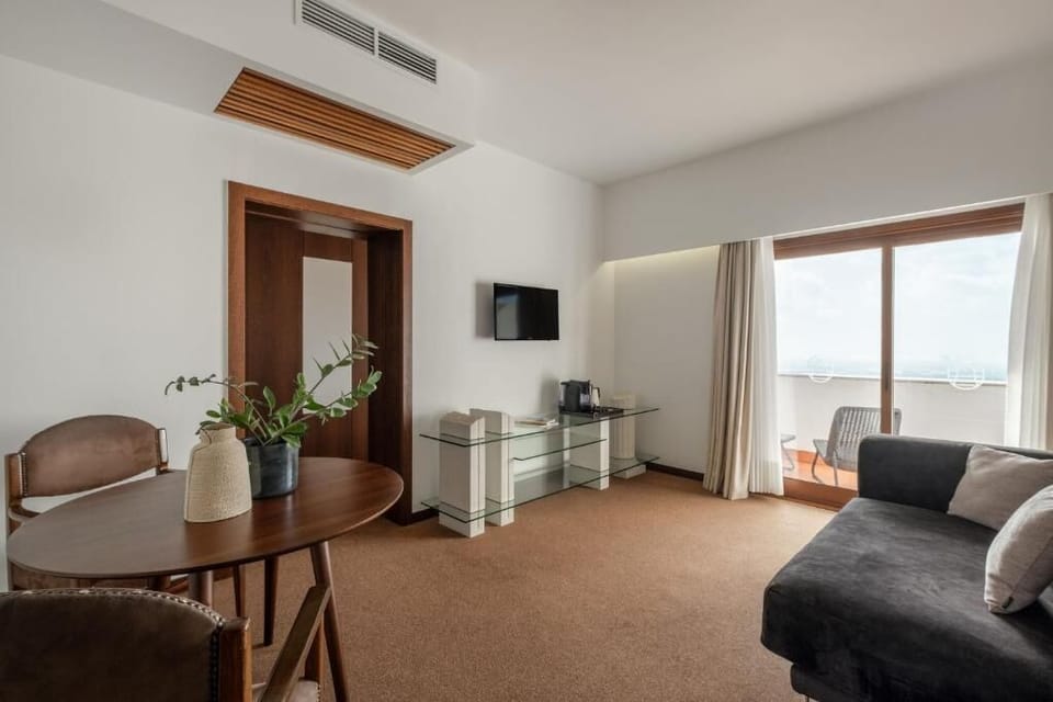 Superior Double Room, Balcony | Living area | 50-cm TV with cable channels