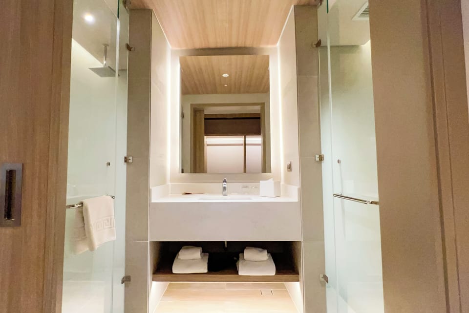 Deluxe Twin | Bathroom | Free toiletries, hair dryer, slippers, towels
