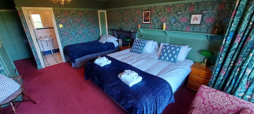 Family Room | Desk, blackout drapes, iron/ironing board, free WiFi
