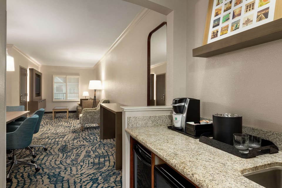 Suite, 1 King Bed (Conference) | Living area | 32-inch LCD TV with cable channels, TV, iPod dock