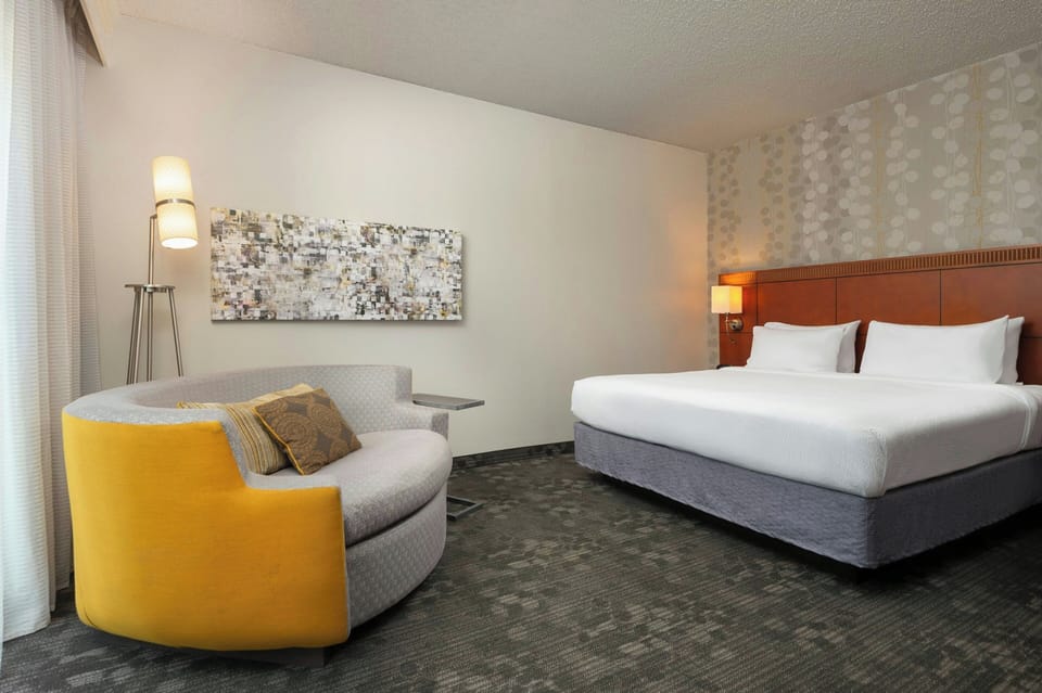 Desk, laptop workspace, iron/ironing board, free cribs/infant beds