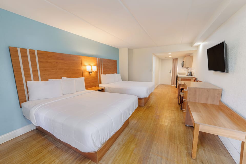 Deluxe Room, 2 Queen Beds, Kitchenette | Blackout drapes, rollaway beds, free WiFi, bed sheets