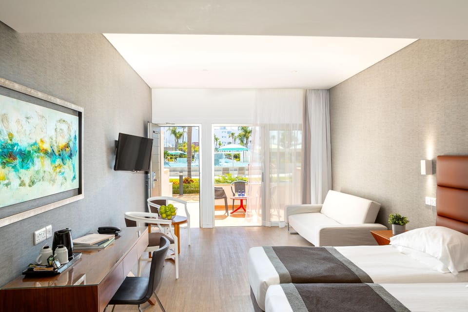 Garden Suite, Poolfront | Premium bedding, down comforters, in-room safe, desk