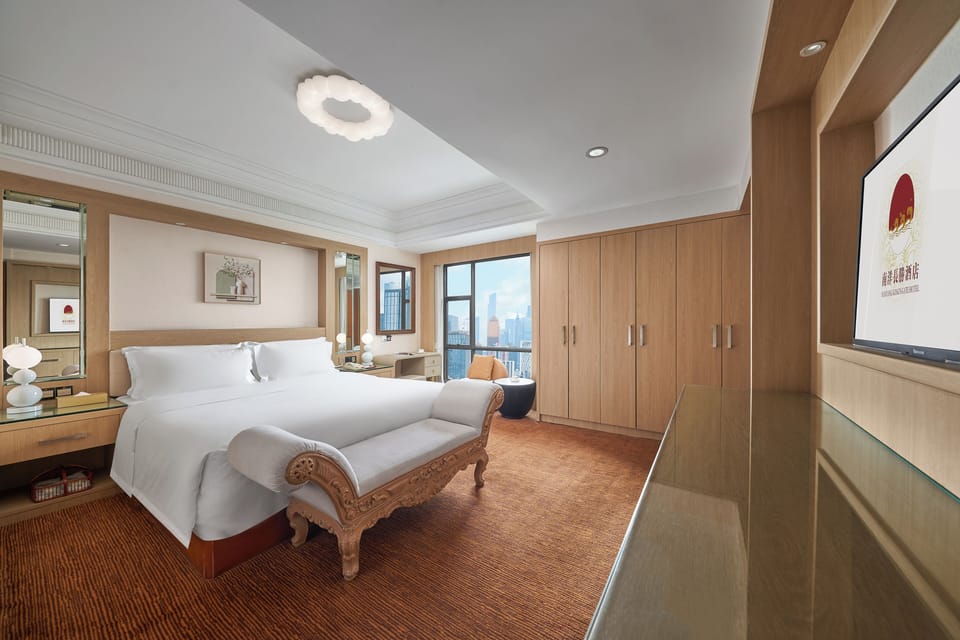 Affordable Luxury Kingbed Suite | Premium bedding, down comforters, memory foam beds, free minibar