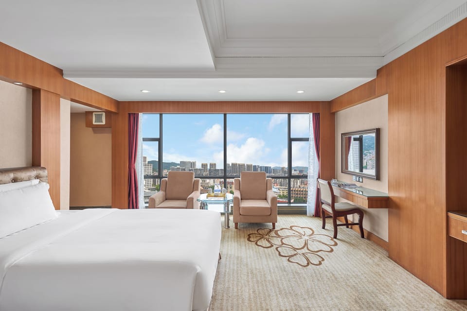 Affordable Luxury Twin Beds Suit | Premium bedding, down comforters, memory foam beds, free minibar