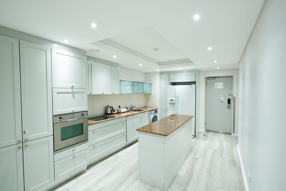 Suite, 3 Bedrooms, Non Smoking, City View | Private kitchen | Full-size fridge, microwave, oven, stovetop