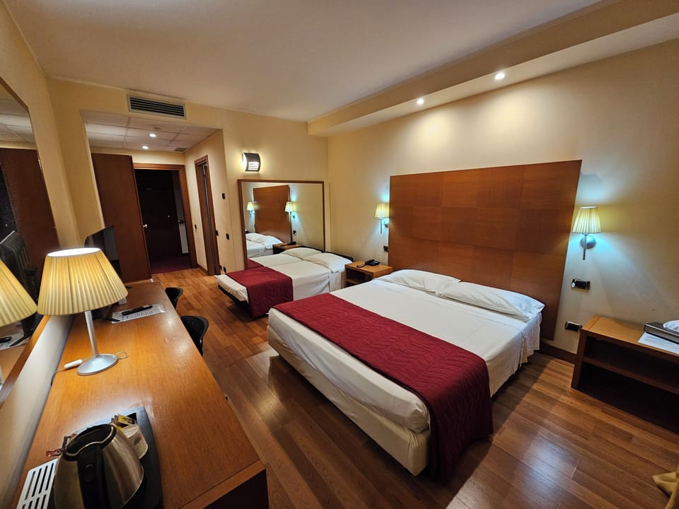 Business Triple Room | Down comforters, minibar, in-room safe, desk