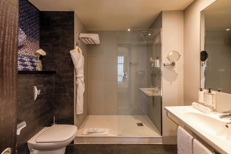 Shower, designer toiletries, hair dryer, bidet