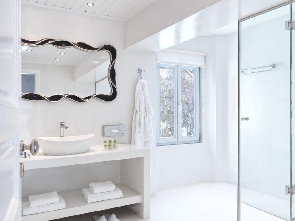 Suite, Sea View | Bathroom | Shower, free toiletries, hair dryer, slippers