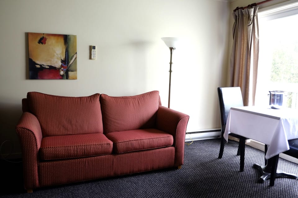 King Suite with Fireplace | Living area | 43-inch Smart TV with digital channels