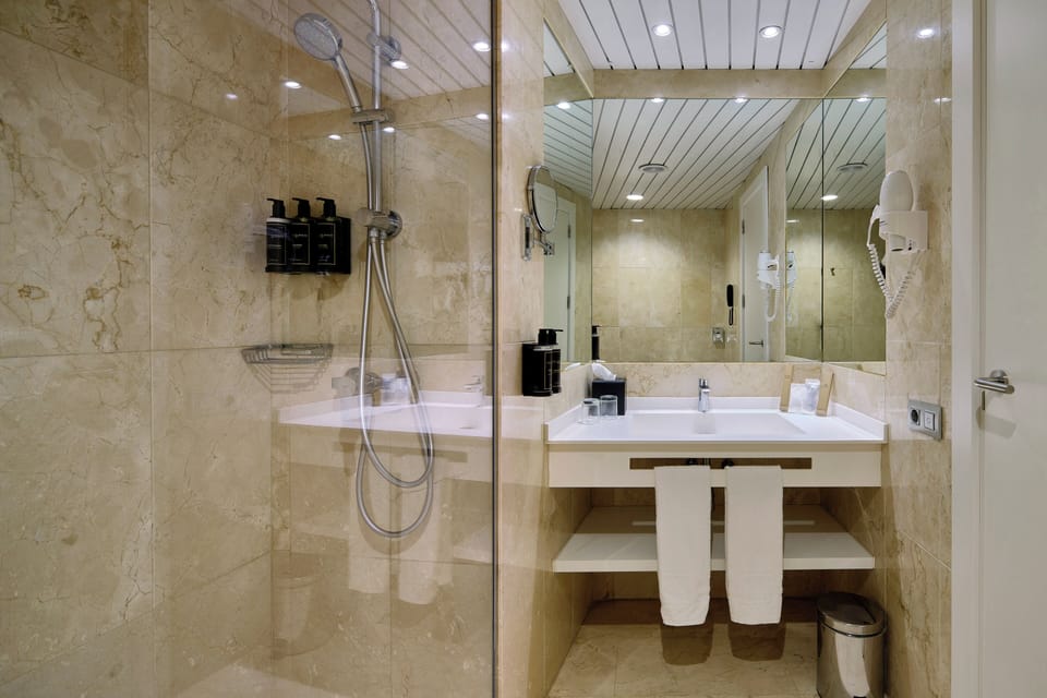 Eco-friendly toiletries, hair dryer, towels, soap