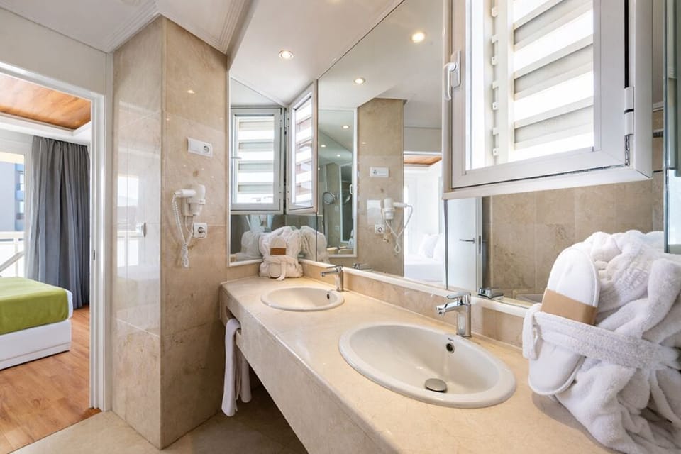 Junior Suite, 1 Queen Bed, Terrace, Sea View | Bathroom | Free toiletries, hair dryer, towels, soap
