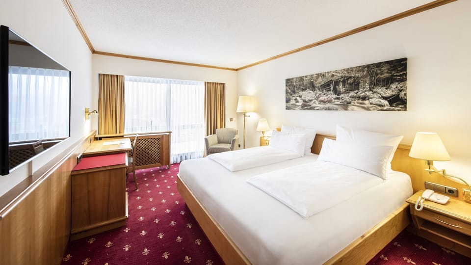Suite, 2 Bathrooms (Sonnenhof) | Minibar, in-room safe, desk, laptop workspace