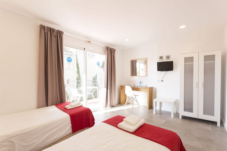 Grand Twin Room, Pool View | Desk, laptop workspace, blackout drapes, iron/ironing board