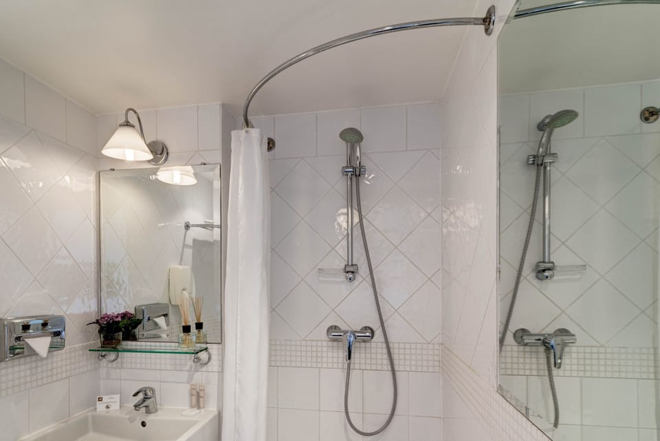 Single Room - Complimentary soft minibar,courtesy tray, Chromecast, digital press | Bathroom | Free toiletries, hair dryer, towels