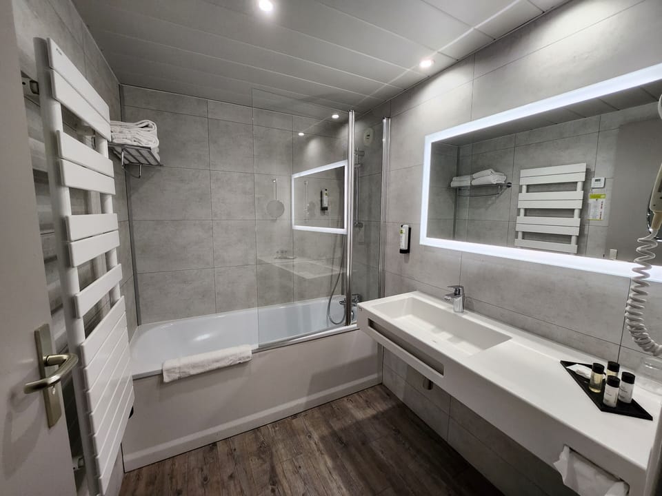 Bathtub, hair dryer, towels, soap