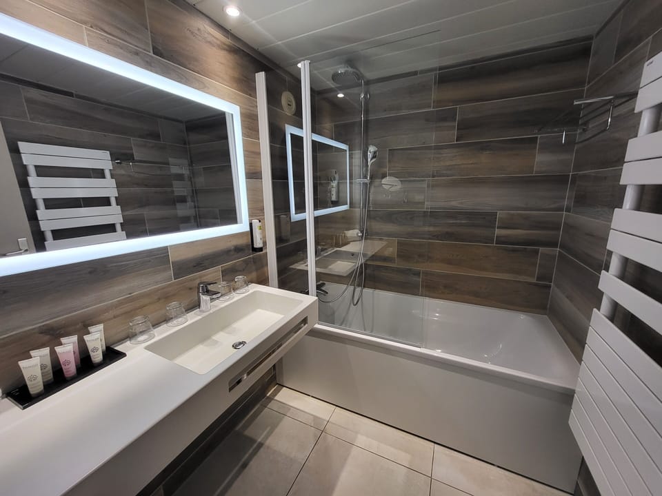 Bathtub, hair dryer, towels, soap