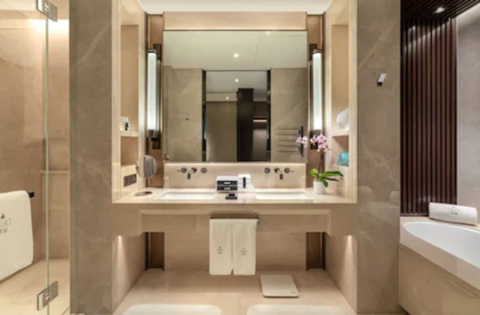 Separate tub and shower, rainfall showerhead, eco-friendly toiletries