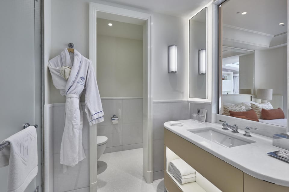 Suite (OASIS) | Bathroom | Designer toiletries, hair dryer, bathrobes, slippers
