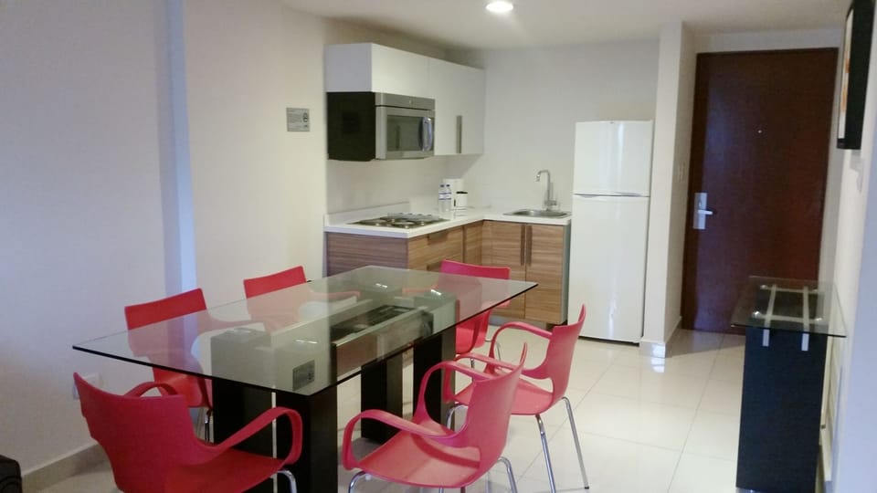 Suite, Kitchenette | Private kitchen | Coffee/tea maker, full-size fridge, microwave