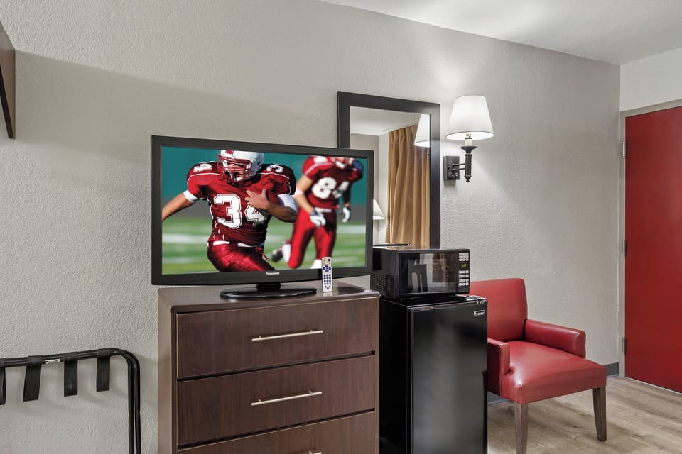Deluxe Room, 1 Queen Bed, Accessible, Non Smoking | Desk, laptop workspace, blackout drapes, iron/ironing board