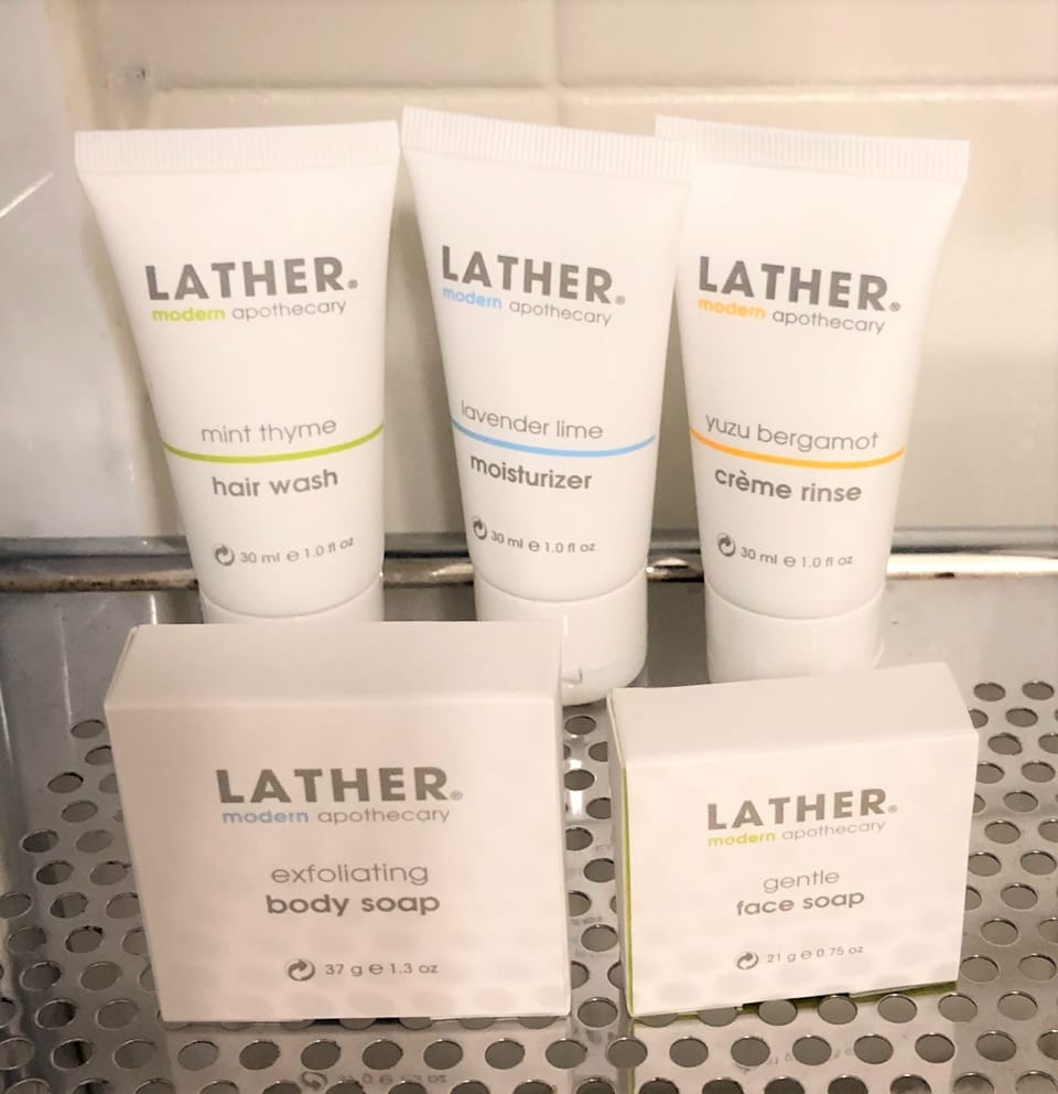 Shower, designer toiletries, hair dryer, bathrobes