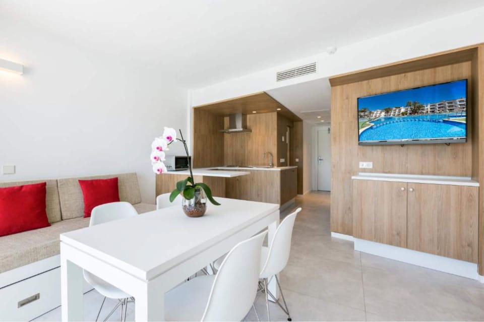 Family Apartment, 1 Bedroom, Balcony | Living area | 42-inch flat-screen TV with satellite channels, TV
