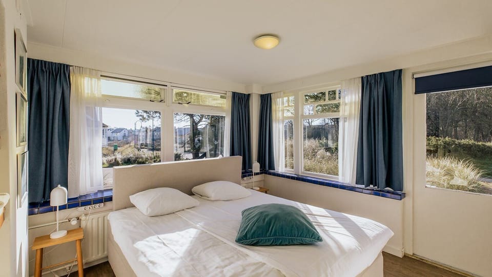Holiday home B | Premium bedding, in-room safe, blackout drapes, iron/ironing board